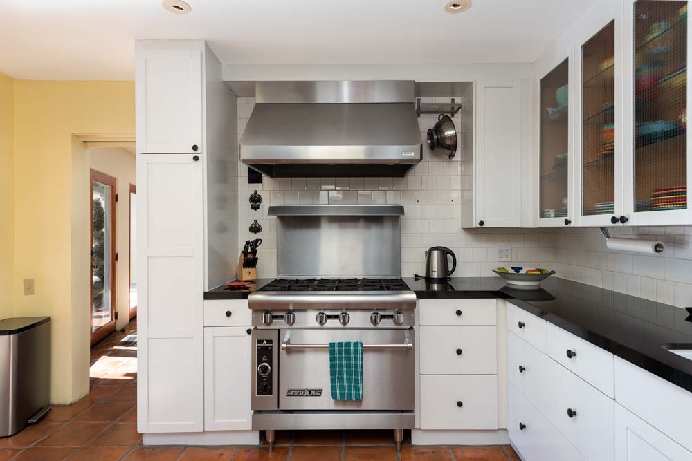 older man having his hair blow dried