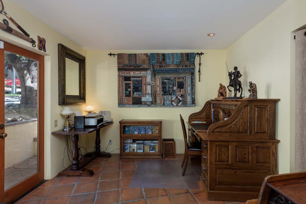 young man side profile having beard trimmed with scissors
